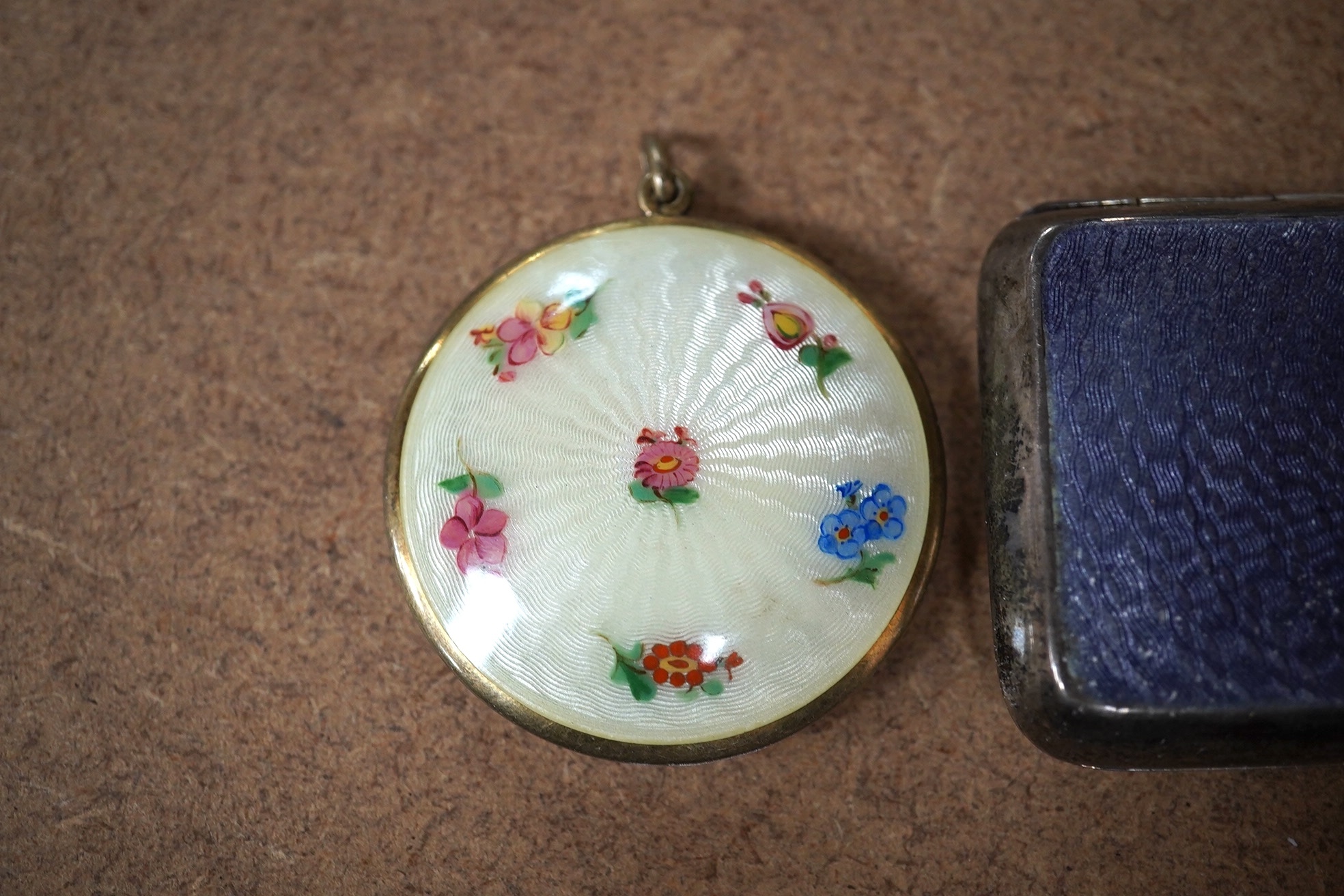 A George V silver and guilloche enamel cigarette case, Henry Clifford Davis, Birmingham, 1917, 84mm, together with a silver and enamel circular compact. Condition - fair